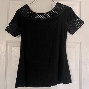Black top with pattern neckline and sleeves